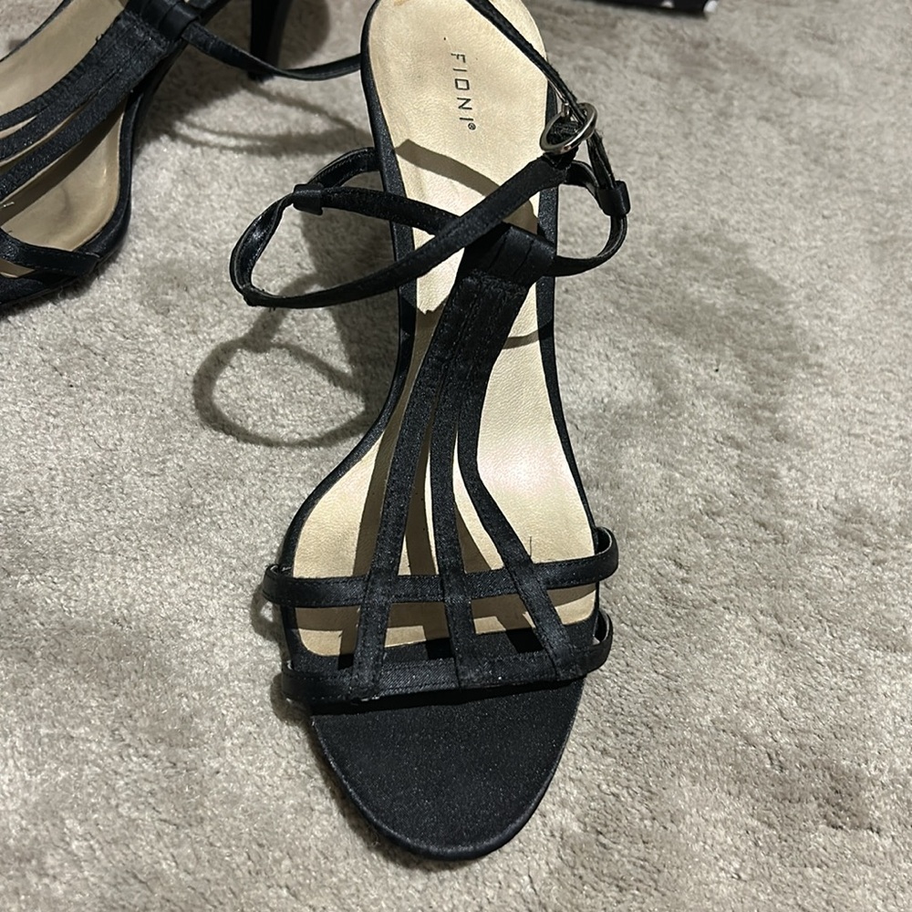 Black evening strappy , sandals.  The heel measures about 3 1/2”. 8 1/2
